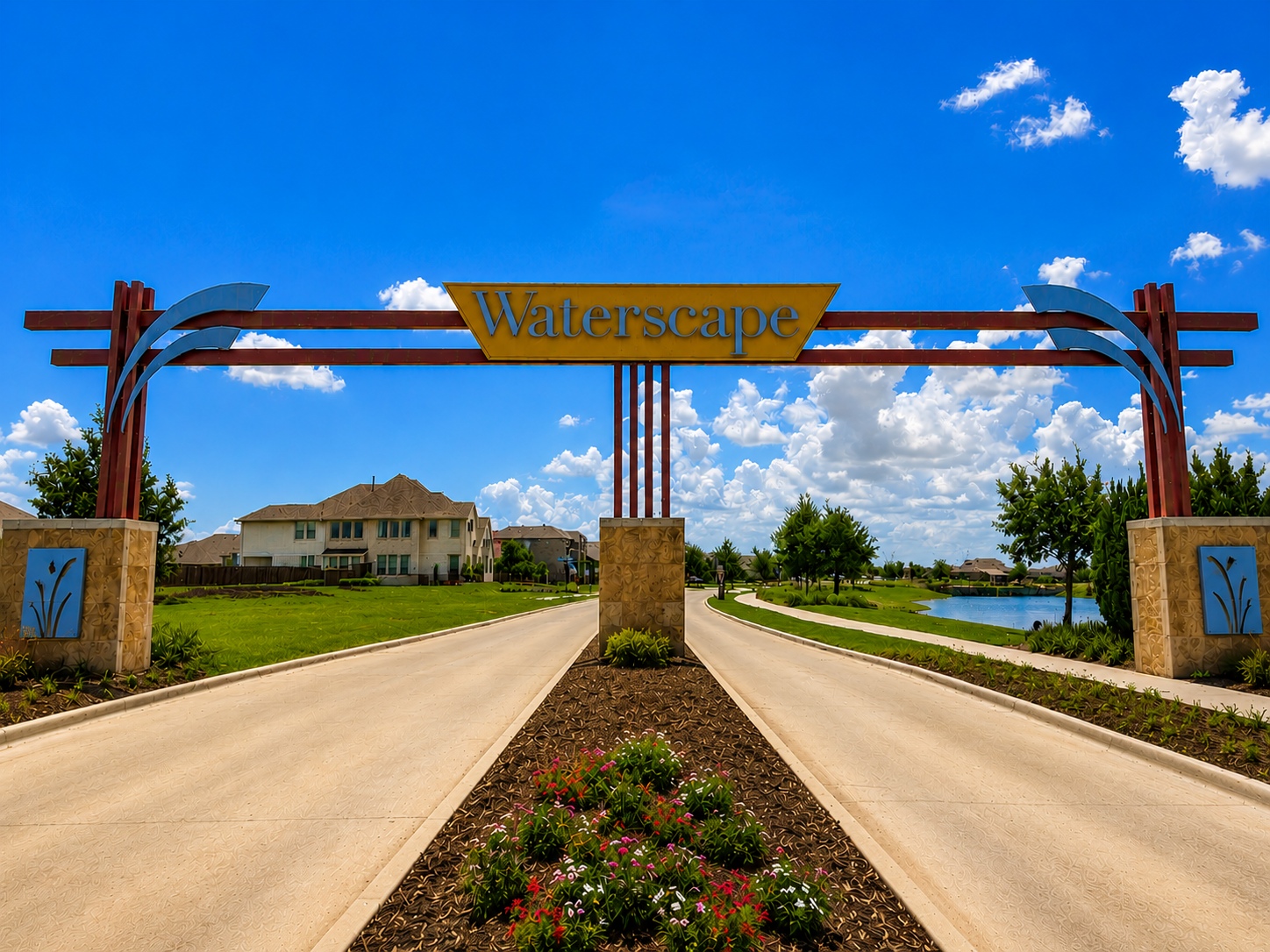 Stone entrance sign that reads Lake Pointe, set in a cream stone wall with blue sky and trees behind.